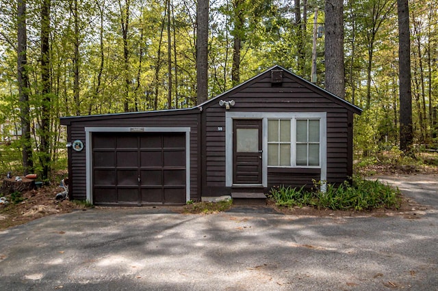 59 Lake Rd, Wakefield, NH 03872 - view of front of home with a garage and asphalt driveway