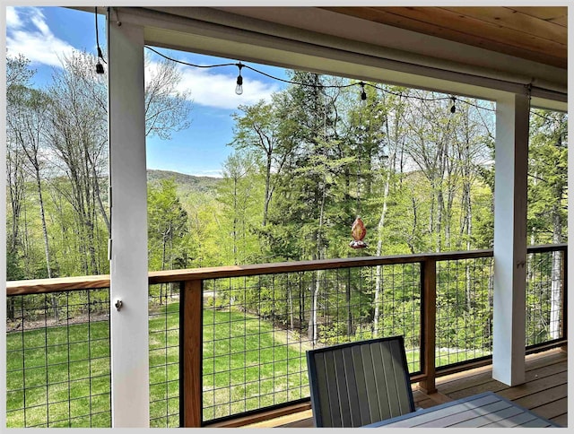 deck with a wooded view