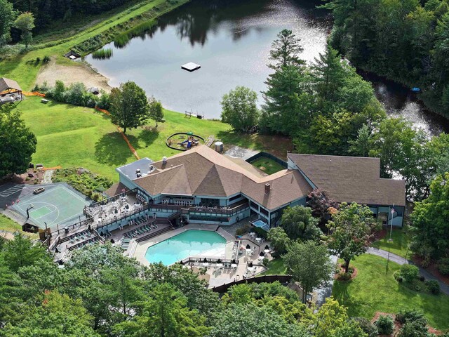 bird's eye view of a large body of water and a pool area