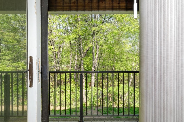 balcony featuring a view of trees