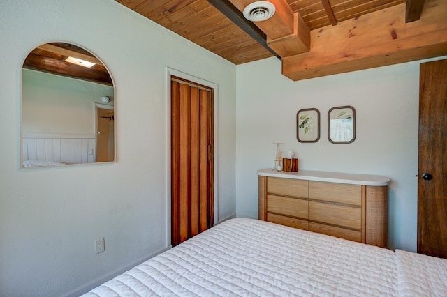 bedroom featuring wooden ceiling and beamed ceiling