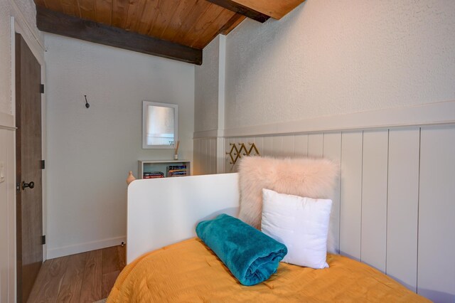 bedroom featuring wood finished floors and wooden ceiling