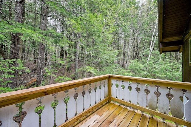 deck featuring a wooded view