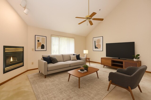 52 Ridgewood Dr Unit 14C, Atkinson, NH 03811 - living room with light carpet, a ceiling fan, baseboards, high vaulted ceiling, and a glass covered fireplace
