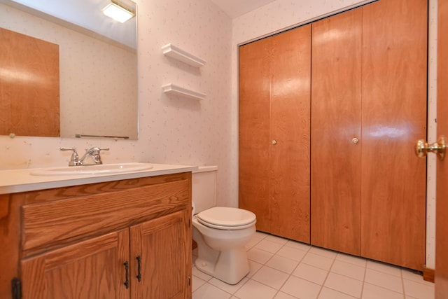 52 Ridgewood Dr Unit 14C, Atkinson, NH 03811 - bathroom featuring toilet, vanity, wallpapered walls, and tile patterned floors