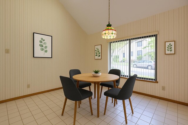52 Ridgewood Dr Unit 14C, Atkinson, NH 03811 - dining area with vaulted ceiling, wallpapered walls, and baseboards