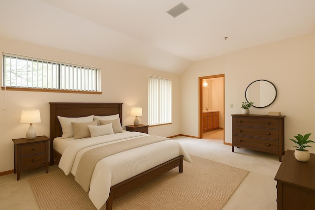 52 Ridgewood Dr Unit 14C, Atkinson, NH 03811 - bedroom with light colored carpet, vaulted ceiling, baseboards, and connected bathroom