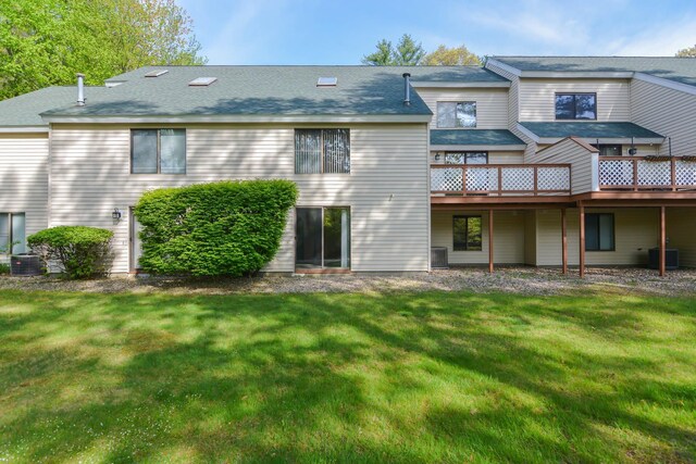 52 Ridgewood Dr Unit 14C, Atkinson, NH 03811 - back of property with central AC, a yard, and a deck
