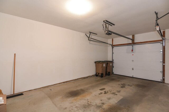 52 Ridgewood Dr Unit 14C, Atkinson, NH 03811 - garage featuring a garage door opener