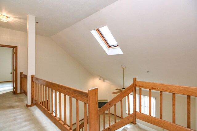 52 Ridgewood Dr Unit 14C, Atkinson, NH 03811 - staircase with a skylight, carpet flooring, vaulted ceiling, and ceiling fan