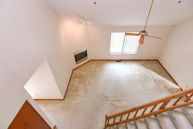 52 Ridgewood Dr Unit 14C, Atkinson, NH 03811 - unfurnished living room featuring heating unit, ceiling fan, baseboards, and carpet flooring