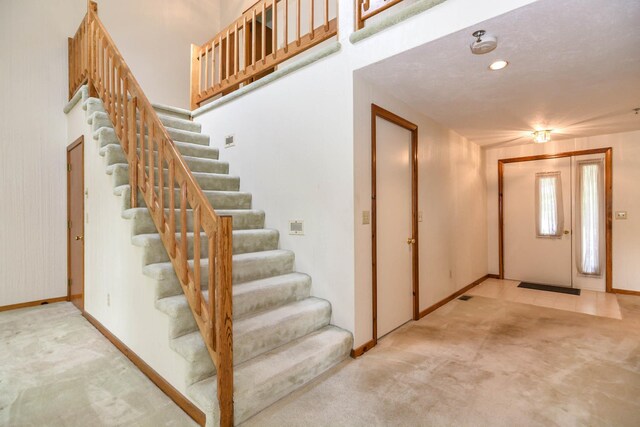 52 Ridgewood Dr Unit 14C, Atkinson, NH 03811 - stairs with carpet and baseboards