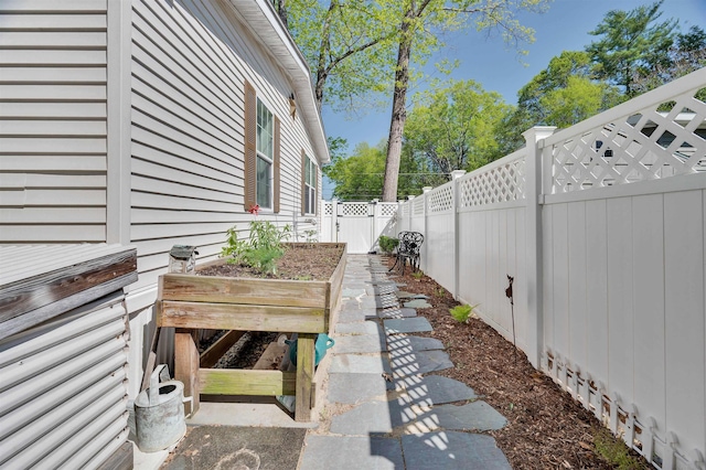 fenced backyard featuring a gate