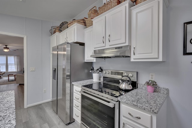kitchen with appliances with stainless steel finishes, under cabinet range hood, white cabinetry, light wood finished floors, and a ceiling fan