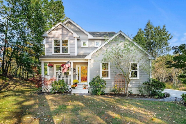 traditional home with a porch and a front yard