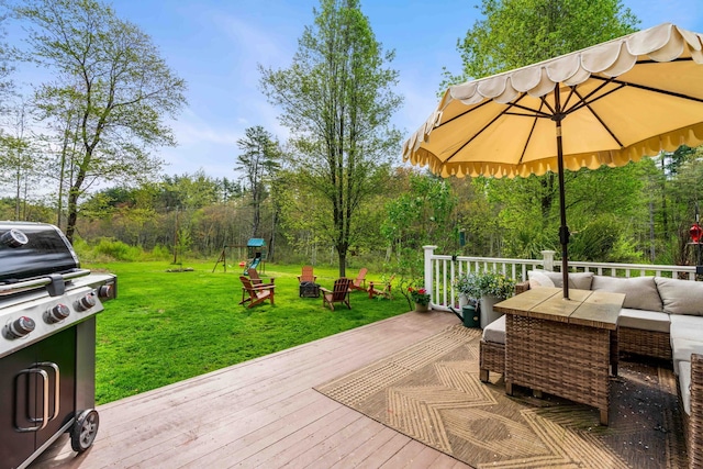wooden deck with outdoor lounge area, a yard, and grilling area
