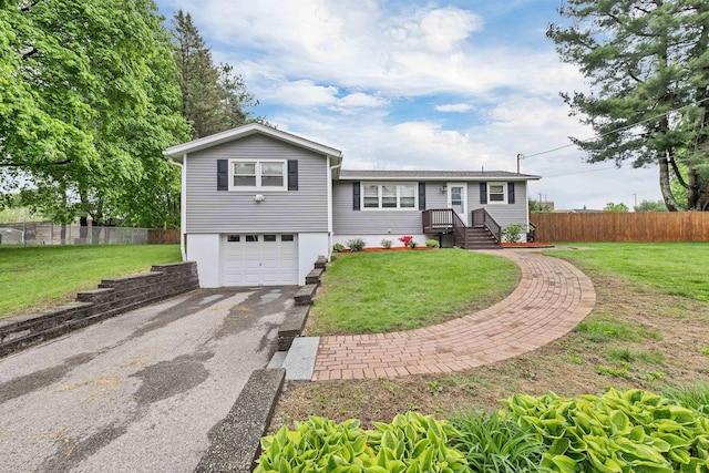 single story home with an attached garage and asphalt driveway