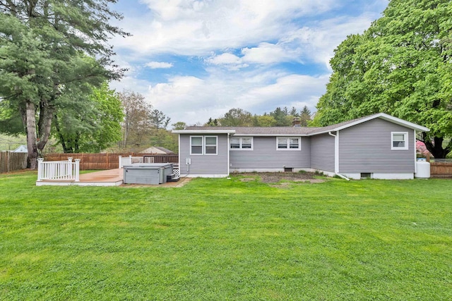 back of property featuring a hot tub and a chimney