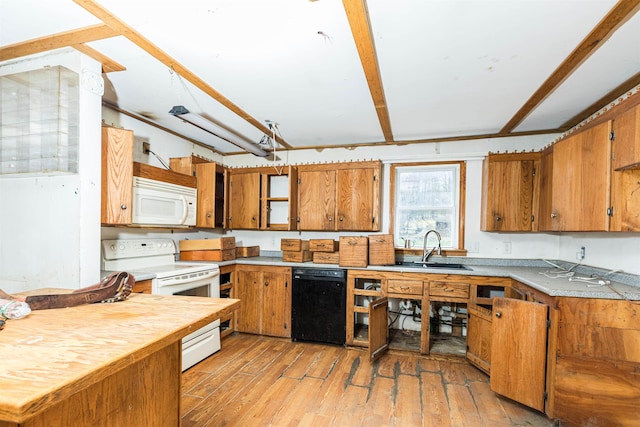 kitchen featuring white appliances, a sink, brown cabinets, and light wood-style flooring