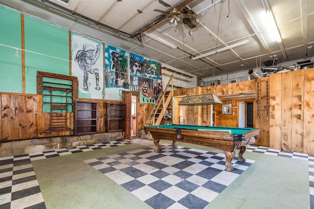 playroom with tile patterned floors, wooden walls, billiards table, a garage, and a ceiling fan