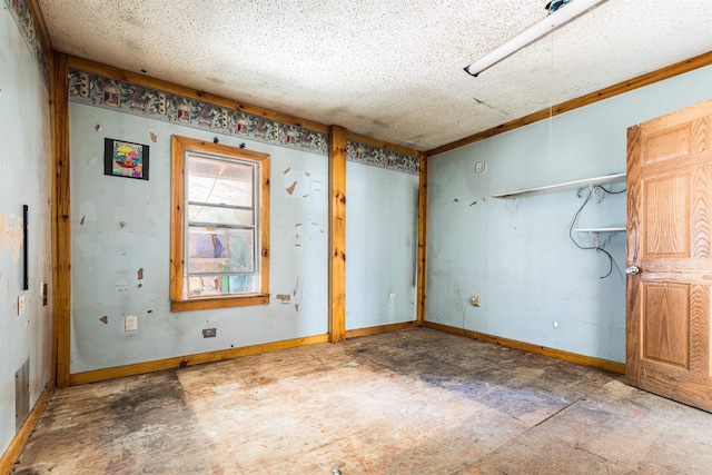 unfurnished room featuring baseboards