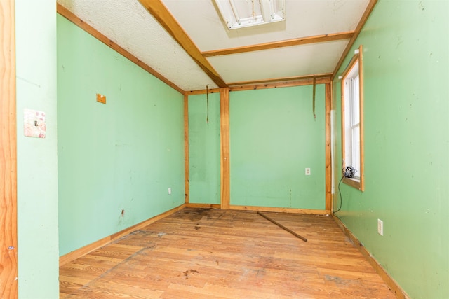 empty room with wood finished floors