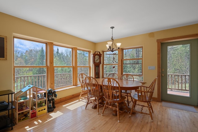 153 Wood Rd, Middlesex, VT 05682 - dining area with a chandelier, healthy amount of natural light, light wood finished floors, and baseboards