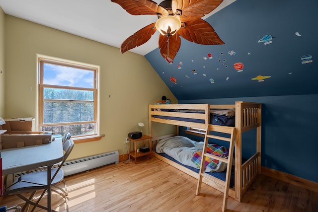 153 Wood Rd, Middlesex, VT 05682 - bedroom featuring wood-type flooring, lofted ceiling, baseboards, baseboard heating, and a ceiling fan