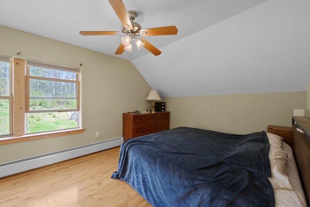 153 Wood Rd, Middlesex, VT 05682 - bedroom featuring baseboard heating, wood finished floors, lofted ceiling, and a ceiling fan