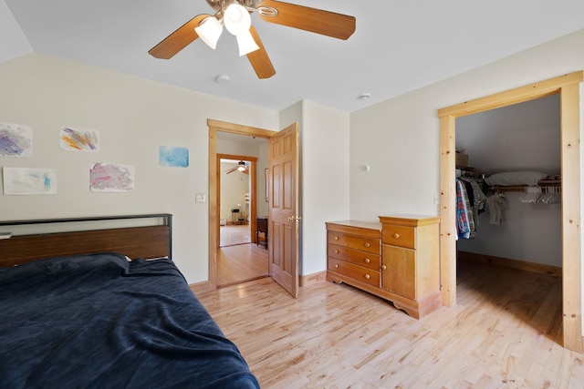 153 Wood Rd, Middlesex, VT 05682 - bedroom featuring light wood-style flooring, baseboards, ceiling fan, a closet, and a walk in closet