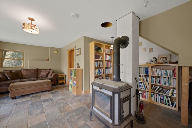 153 Wood Rd, Middlesex, VT 05682 - living area with a wood stove and stone finish flooring