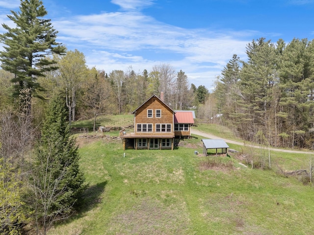 153 Wood Rd, Middlesex, VT 05682 - rear view of property with a lawn, a view of trees, a deck, and a chimney