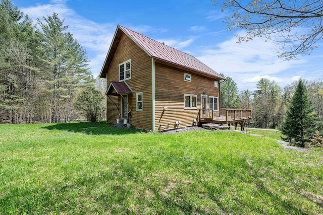 153 Wood Rd, Middlesex, VT 05682 - view of side of home with a deck, a lawn, metal roof, and a standing seam roof