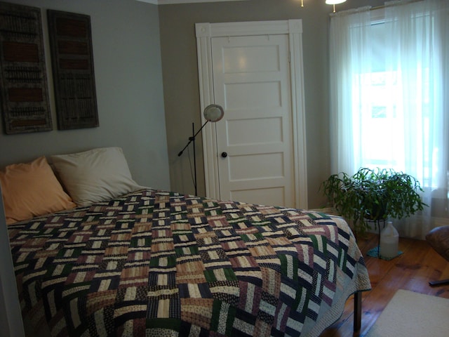 bedroom featuring wood finished floors
