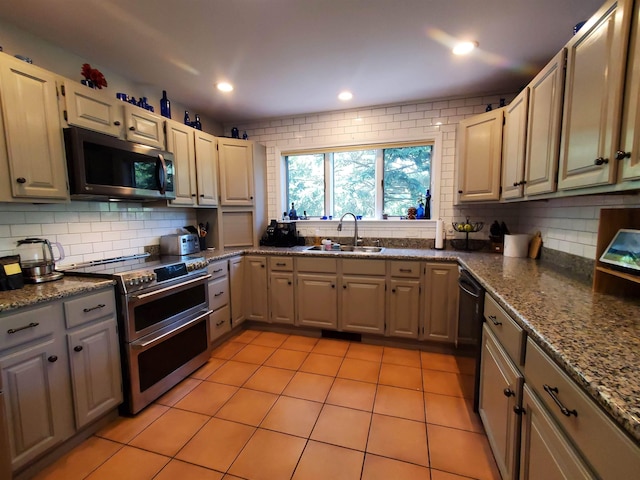 644 Methodist Hill Rd, Enfield, NH 03748 - kitchen with appliances with stainless steel finishes, a sink, decorative backsplash, dark stone countertops, and recessed lighting