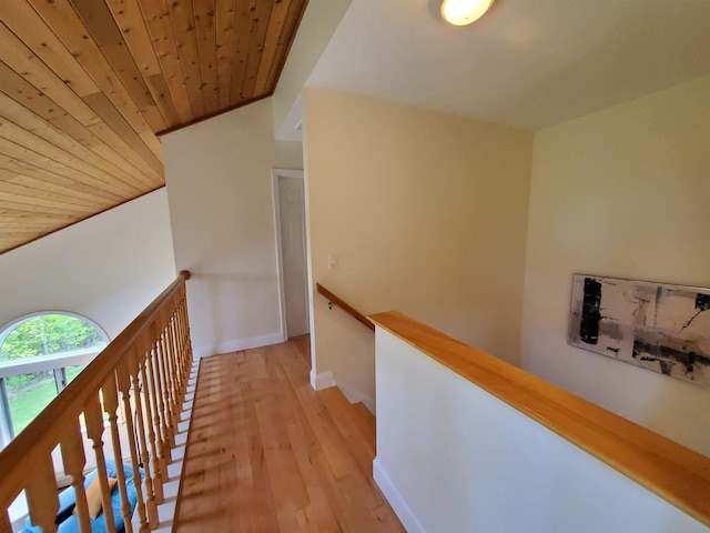 644 Methodist Hill Rd, Enfield, NH 03748 - hallway with an upstairs landing, wood ceiling, light wood-style floors, baseboards, and vaulted ceiling