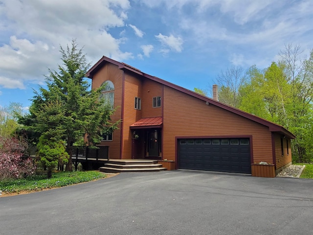 644 Methodist Hill Rd, Enfield, NH 03748 - view of front facade with asphalt driveway, an attached garage, and a chimney