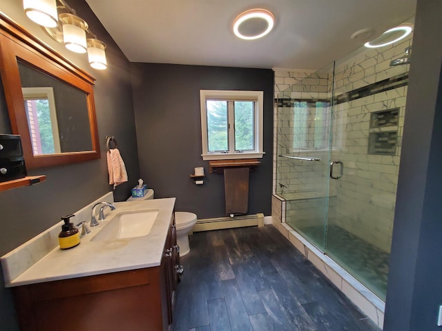 644 Methodist Hill Rd, Enfield, NH 03748 - full bathroom featuring a baseboard heating unit, plenty of natural light, a stall shower, and wood finished floors