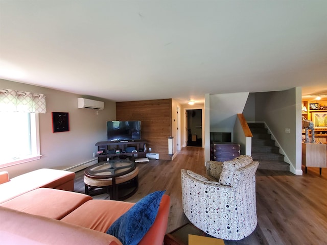 644 Methodist Hill Rd, Enfield, NH 03748 - living room with a baseboard heating unit, an AC wall unit, wood finished floors, and stairs
