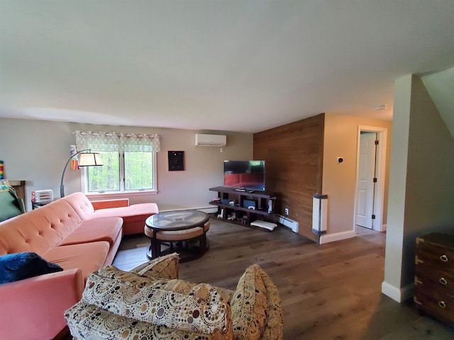 644 Methodist Hill Rd, Enfield, NH 03748 - living area featuring a wall mounted AC, wood finished floors, and baseboards