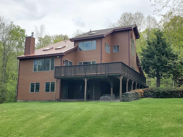644 Methodist Hill Rd, Enfield, NH 03748 - back of house with a chimney, a yard, and a deck
