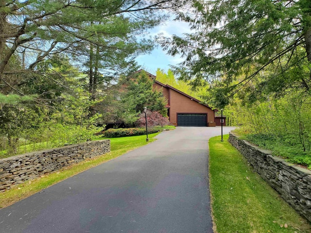 644 Methodist Hill Rd, Enfield, NH 03748 - view of front of house featuring asphalt driveway, an attached garage, and a front lawn