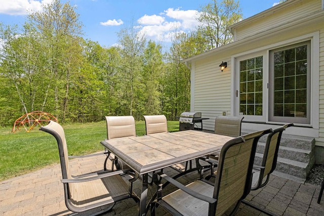 view of patio / terrace featuring outdoor dining space and area for grilling