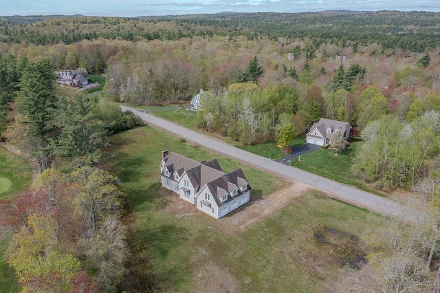 aerial overview of property's location with a forest