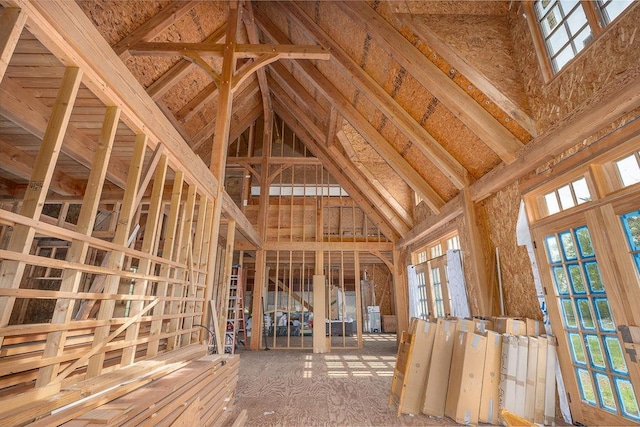 misc room featuring plenty of natural light and high vaulted ceiling