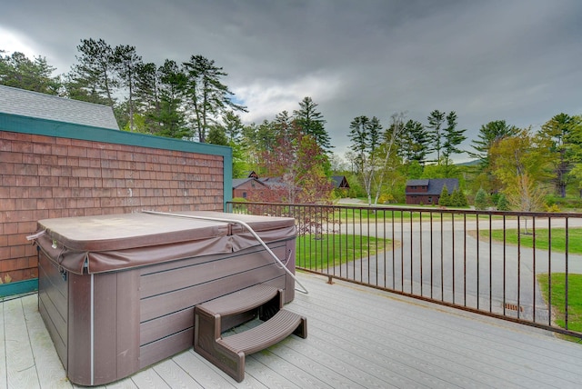 wooden terrace with a hot tub