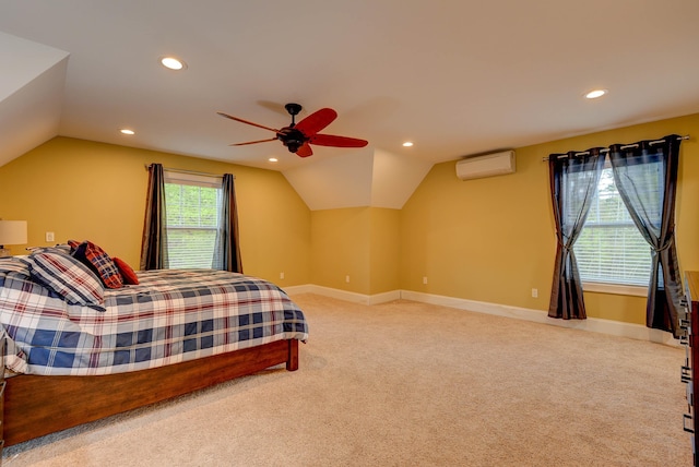 carpeted bedroom featuring an AC wall unit, lofted ceiling, recessed lighting, baseboards, and a ceiling fan
