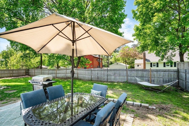 view of patio / terrace with outdoor dining area and a grill