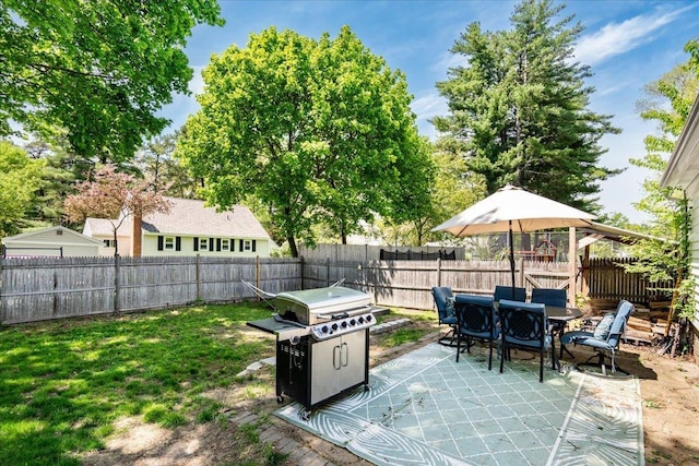 view of patio featuring outdoor dining space and grilling area