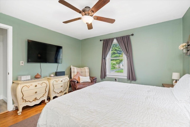 bedroom featuring wood finished floors and ceiling fan